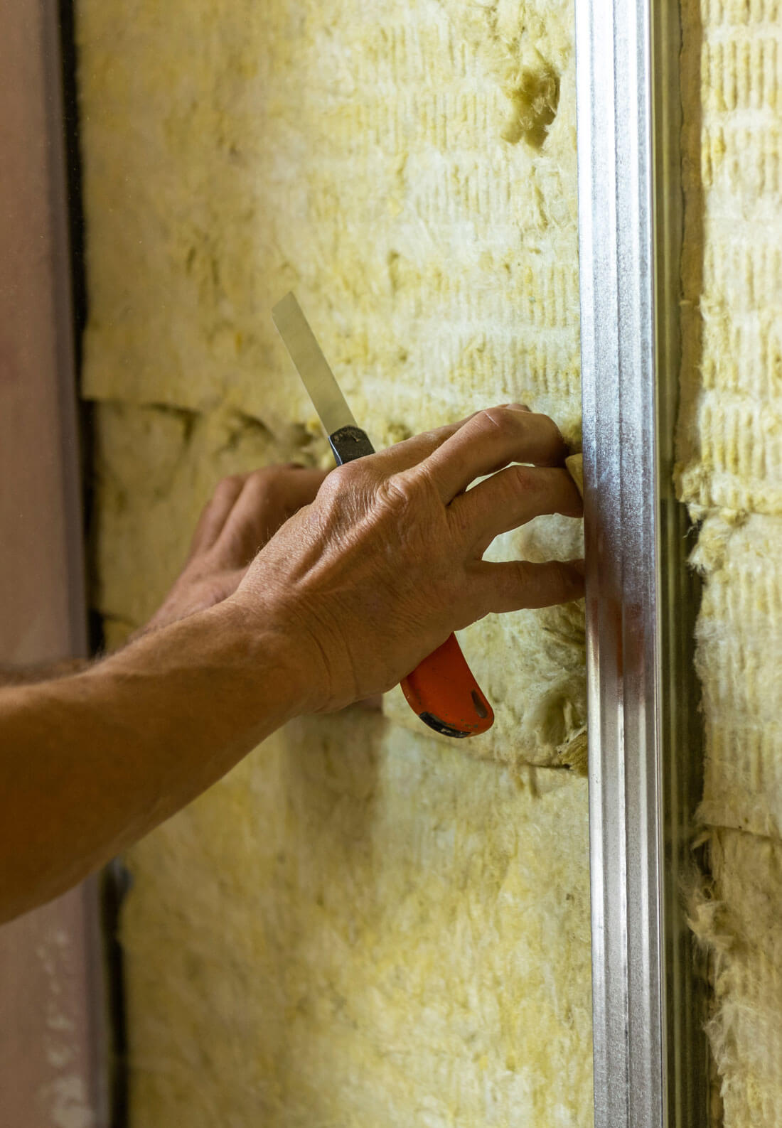 Worker Insulating A Room Wall With Mineral Rock Wool Thermal Ins